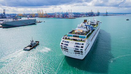 Cruise ships sailing the sea take tourists on a journey and relax on holidays.
