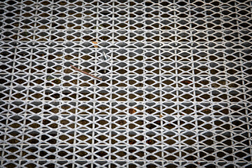 Galvanized metal grating surface for pedestrian walkway ramp or crossing providing drainage durability and safety with industrial texture pattern