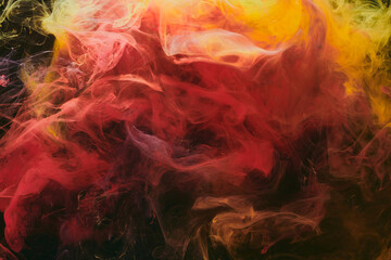 Abstract colorful smoke, dark background. Moving flow of red paints, fluid art
