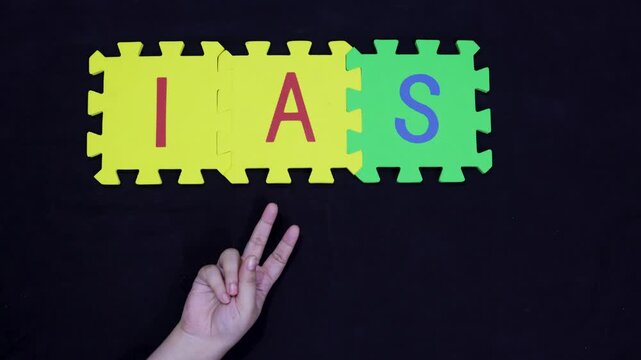 ias public service and examination hands presenting victory on black background