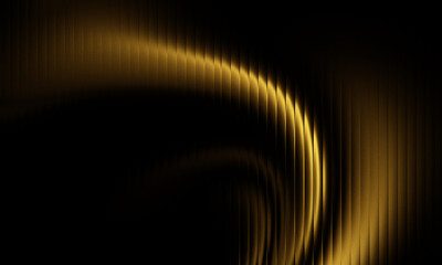 Abstract golden light streaks with a dark background creating a sense of motion and energy
