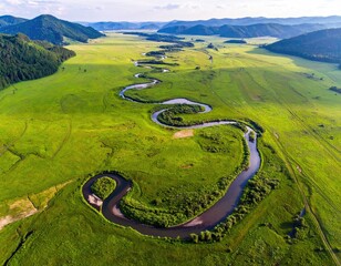 Winding river through green valley