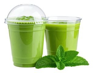 Two green smoothies in transparent cups, with mint leaves. One cup has a lid. Healthy, vibrant drink