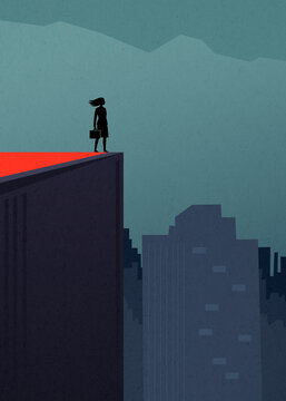 Businesswoman on rooftop overlooking urban skyline in foggy city