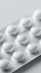 Blister pack with round white tablets arranged in clean minimal composition.
