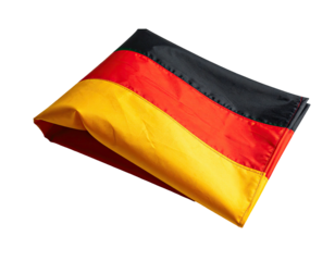 A folded, vibrant flag featuring horizontal stripes of black, red, and gold, isolated on a black background