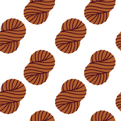 Brown yarn balls forming seamless background for textile prints, fabric design, knitting themes and craft decoration.