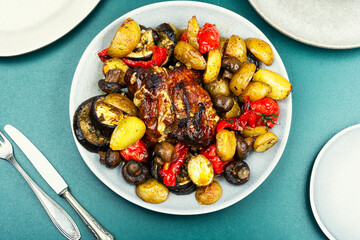 Baked or braised meat with vegetables.