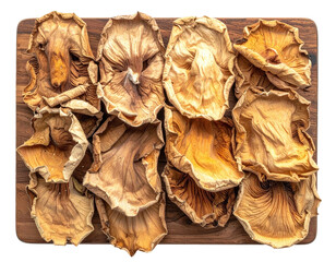 Top-down shot of dried, light brown, and textured fungi arranged on a wooden surface