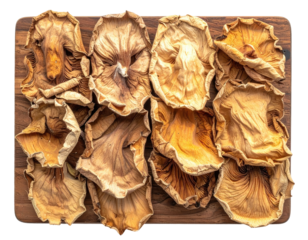 Top-down shot of dried, light brown, and textured fungi arranged on a wooden surface