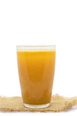 Ripe Indian Bael Fruit Juice or Sharbat in a Glass or Wood Apple Isolated on White Background with Copy Space, Also Known as Aegle Marmelos,Japanese Bitter Orange, Stone Apple or Bengal Quince