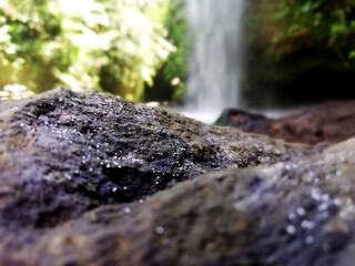 Natural stone foreground, with nature blurry background. Natural background concept