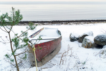Fishing Boat on a Snowy Beach with the Baltic Sea in the Background