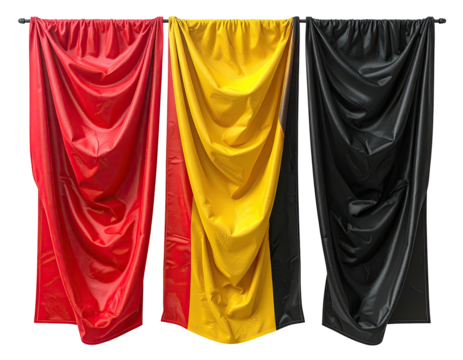 Three vertically hanging swaths of glossy fabric, red, yellow, and black, with draped folds