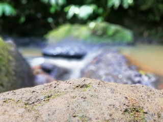 Natural stone foreground, with nature blurry background. Natural background concept