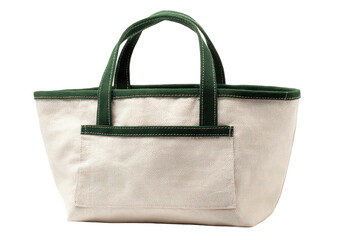 Cream canvas bag w/ green trim & handles. Black background