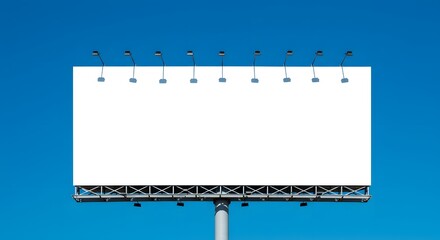 Vast Blank Billboard Under Clear Blue Sky with Overhead Lights.