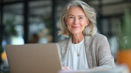 smiling mature middle aged business woman using laptop working on computer sitting at desk happy old businesswoman hr holding cv interviewing distance applicant senior seeker searching job online no 