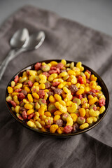 Fruity Kids Breakfast Cereal with Milk in a Bowl, side view.