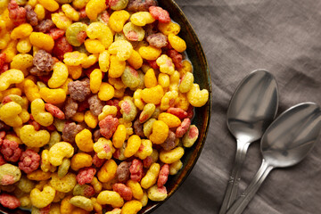 Fruity Kids Breakfast Cereal with Milk in a Bowl, top view.