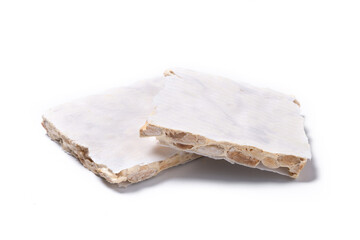 Delicious almond nougat isolated on white background