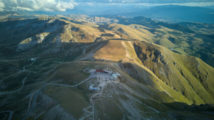 Aerial drone footage of the Astronomical Observatory of Abruzzo at Campo Imperatore, set against majestic mountain landscapes