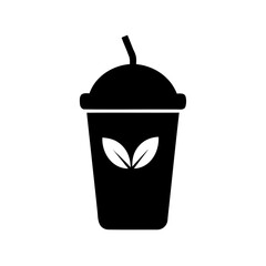 Black silhouette of a healthy green smoothie drink with straw and leaves