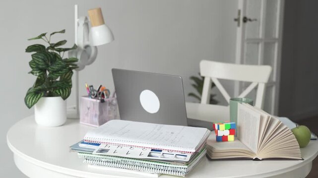 Desk table workspace for student or pupil for school or college. Educational stuff for child, online lessons at home, remote course, homework for child, schooling. White concept with copy space