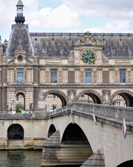 Facade of the Louvre Museum and Pont Royal bridge over the Seine River in Paris France