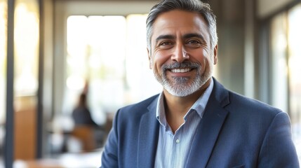 Fototapeta premium Confident Middle-Aged Indian Executive Smiling in a Cozy Boardroom During Business Meeting