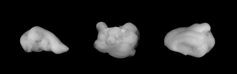 White foam bubbles isolated on black background, showing soft soap texture and clean freshness concept. Perfect for hygiene, skincare, cleaning product advertising, and spa design visuals.