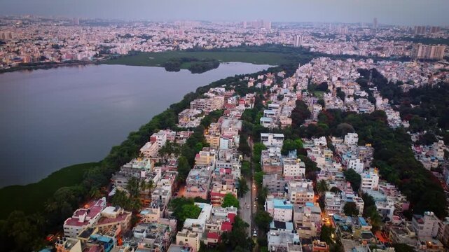 Aerial shot of BTM lake and city skyscrappers in background in Bangalore, Karnataka, India	