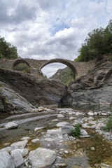 Old stone arch bridge in Ligurian Alps mountains, Molini di Triora municipality, Imperia province, Italy