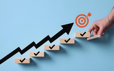 Business growth and goal achievement concept with hand building staircase blocks, upward arrow, and target symbol representing success and progress steps
