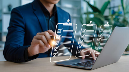 Checklist and task management concept showing businessman marking virtual boxes on laptop, representing productivity, organization, and project planning