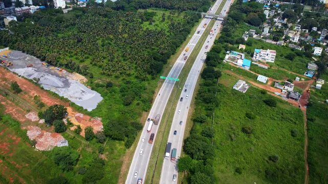 Ariel Shot of beautiful Bangalore City in India with nice road highway connecting Mysore passingby in Karnataka, India