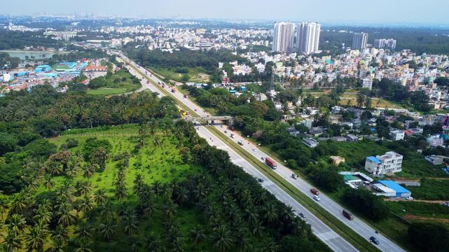 Ariel Shot of beautiful Bangalore City in India with nice road highway connecting Mysore passingby in Karnataka, India