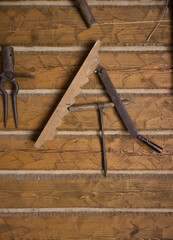 Ancient equipment of a peasant's house. Historical wooden tools. Tools for the daily operation of an ancient house. Work tools for life in the Middle Ages.