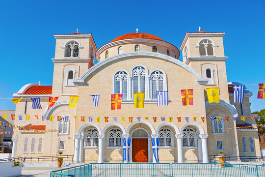 Apostle Barnabas Cathedral is modern Greek Orthodox church in Nicosia, Cyprus, Franco Byzantine architecture. Twin bell towers, central dome and a facade adorned with flags and religious iconography