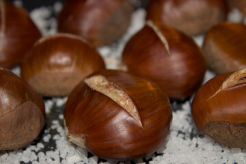 Baked chestnuts with salt at the base