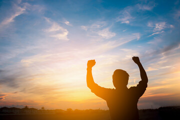 silhouette of a happy man and  sunset