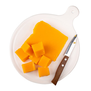 Pumpkin marmalade. Homemade pumpkin jelly candies on white plate  isolated on white background. Top view.