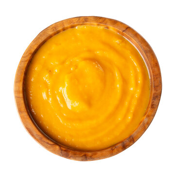 Pumpkin soup  puree,  cream soup in wooden bowl isolated on white background. Top view.