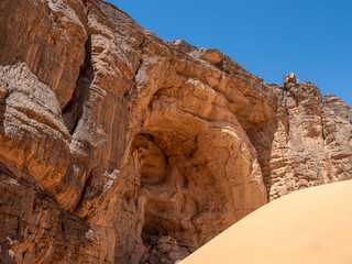 Rock paintings of the Tadrart Rouge in the Sahara Desert. Prehistoric art on sandstone walls with high archaeological and cultural value.