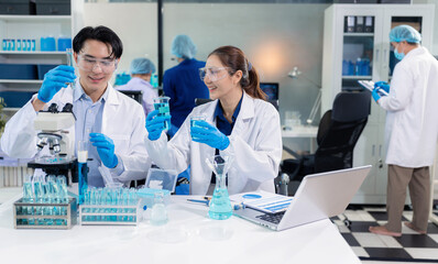 Fototapeta premium scientist researcher conducting an experiment working in the chemical laboratory.