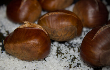 Baked chestnuts with salt at the base