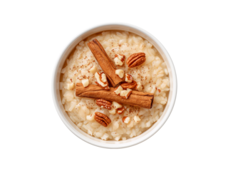 Bowl of Creamy Rice Pudding Topped with Cinnamon Sticks