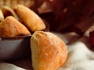 autumn seasonal baking, apple pie pastries, traditional ukrainian bakery, cozy atmosphere with apples, cinnamon sticks, white linen textile, warm tones knitwear