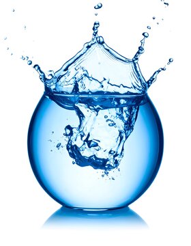 A round glass bowl fills with clear, blue liquid. As something drops in, it creates a splash, with water droplets visible. The background is white