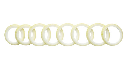 Several sliced onion rings are arranged horizontally next to each other against a stark isolated background.